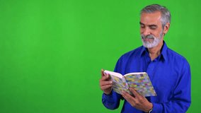 old senior man reads book - green screen - studio - Powered by Shutterstock - Get 15% off with code: PIKWIZARD15
