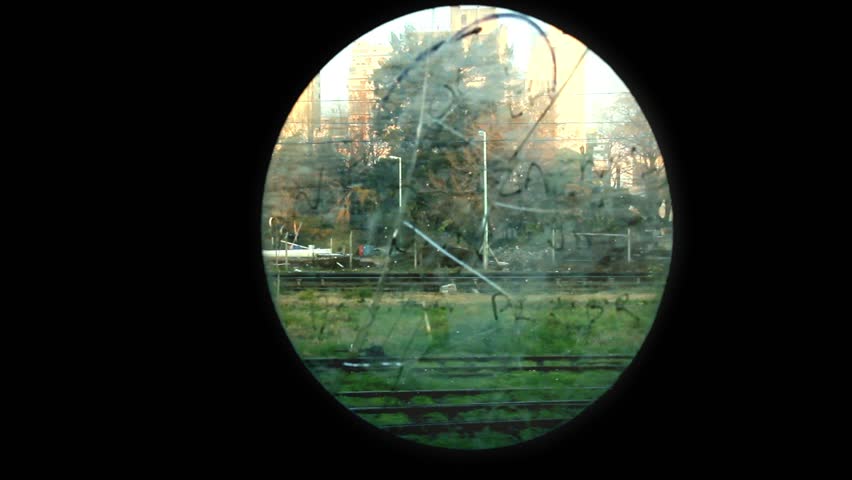 Passenger Train Seen Through Round Window of Old Carriage, Buenos Aires, Argentina