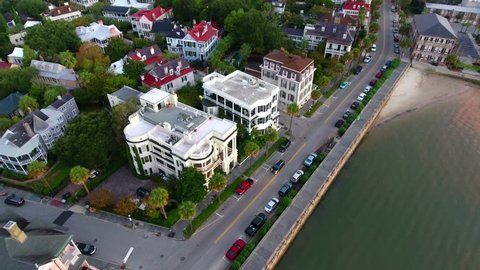 4k Aerial of Charleston South Carolina at Sunrise. Aerial flying over city of Charleston in the morning. Urban historic costal town at sunrise. Luxury wealthy town in SC. City of churches.