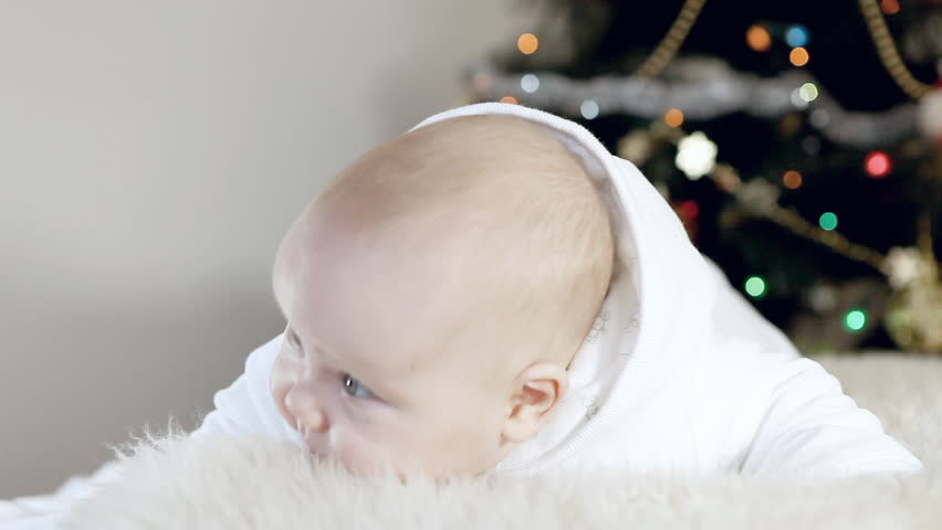 Baby in white on the Christmas  and new year background