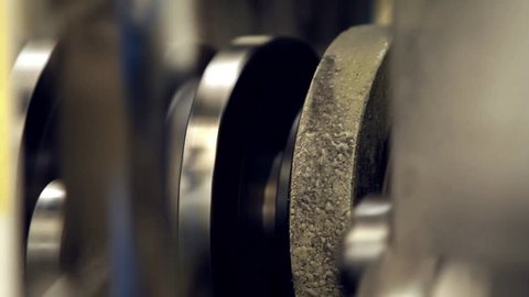 Pistons and Crankshaft at an Industrial Machine. Close Up. Video with Audio. 