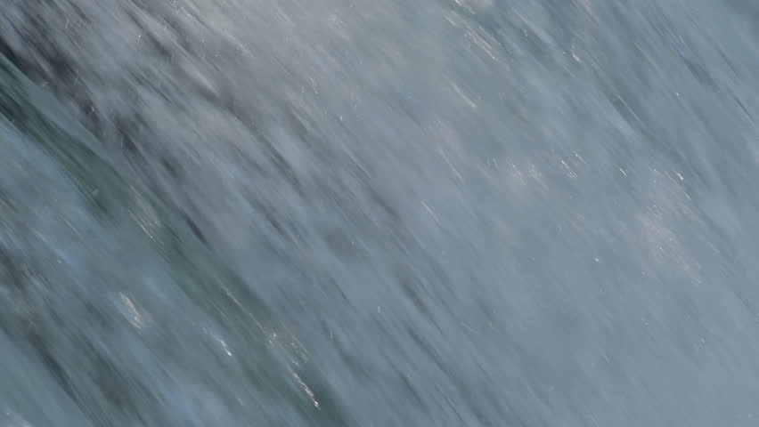 Hundreds of sockeye salmon leaping into the air to try and get over the waterfalls at Brooks Falls in Katmai National Park, Alaska