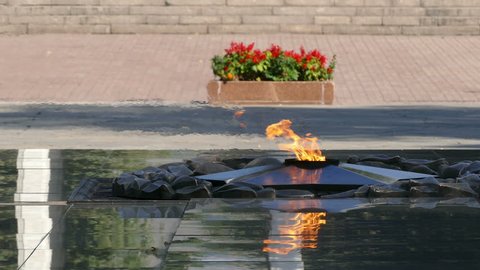 ALMATY, KAZAKHSTAN - SEPREMBER, 2016: Eternal Fire on the memorial of 28 Heroes of the Second World War, who under the command of General Panfilov have participated in the defense of Moscow in 1941.