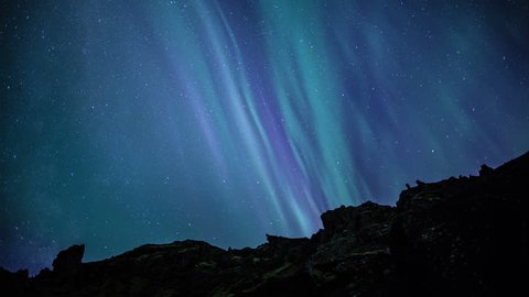 Aurora borealis northern lights over Reykjavik city traffic pond water reflection realistic 4k