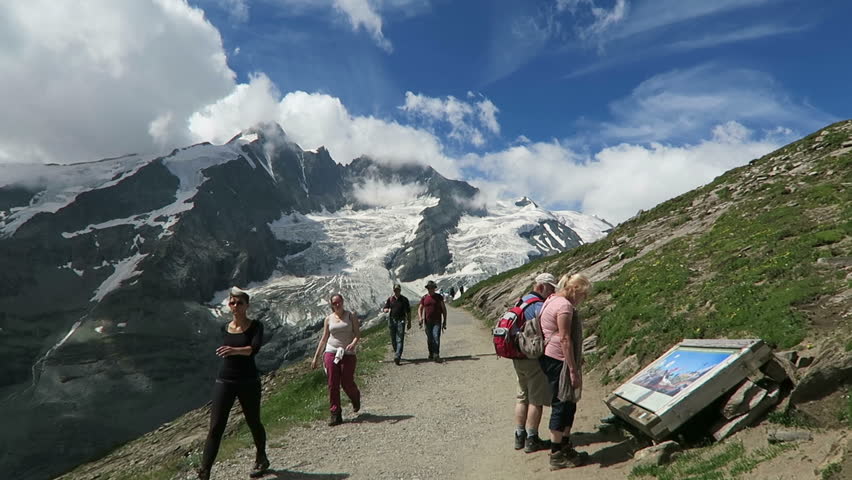 Grossglockner, Salzburger Land/ Austria JULY 29 2016:  Hiker walking along the Gramsgrubenweg path at Grossglockner Mountain area.