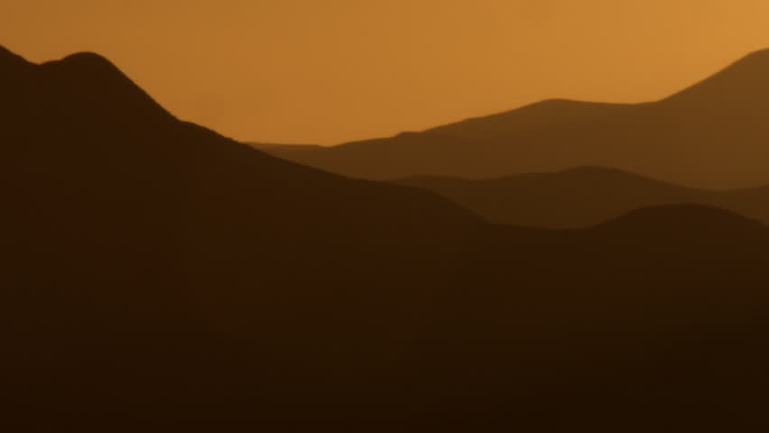 Silhouetted mountains at sunset shot in Israel.