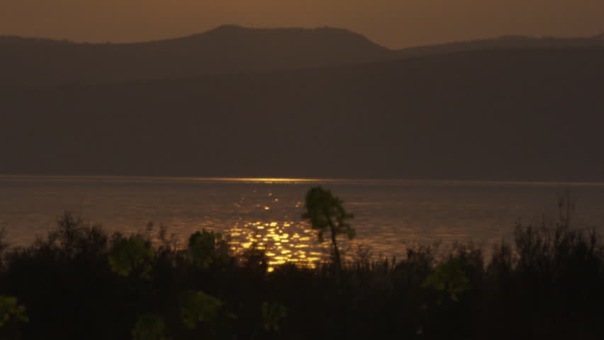 A yellow sunset at the Sea of Galilee shot in Israel.
