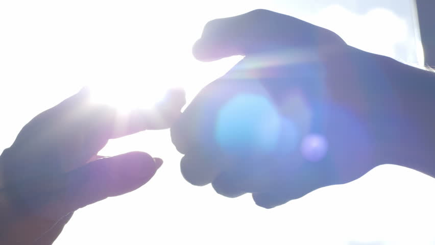 Close-up of young and old hands holding each other. Young man supporting a weak adult woman. | Shutterstock HD Video #20129710