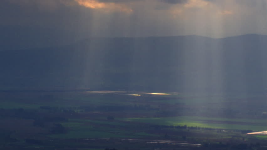 Sun rays illuminating a valley shot in Israel.