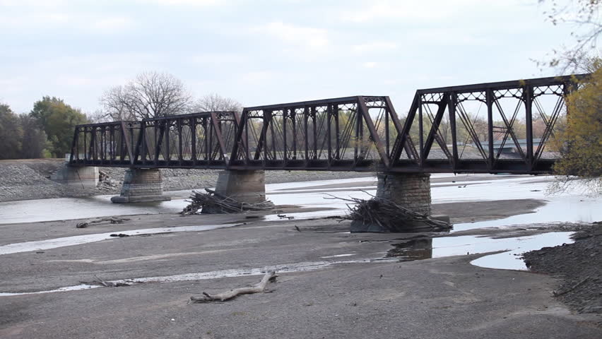 Stationary of a dried out riverbed and a bridge