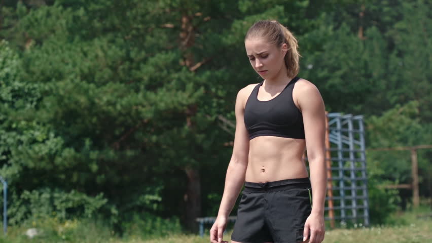 girl in sports bra and shorts