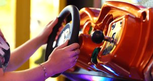 Playing Driving Arcade Video Game - Player Using Steering Wheel Controller - Close Up 2