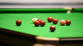 Detail video with snooker player hitting the ball during competition