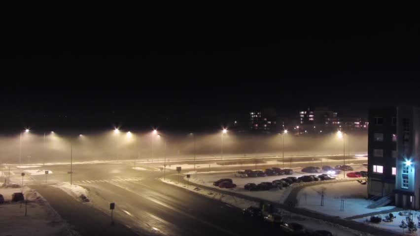 road at night in the fog, time-lapse
