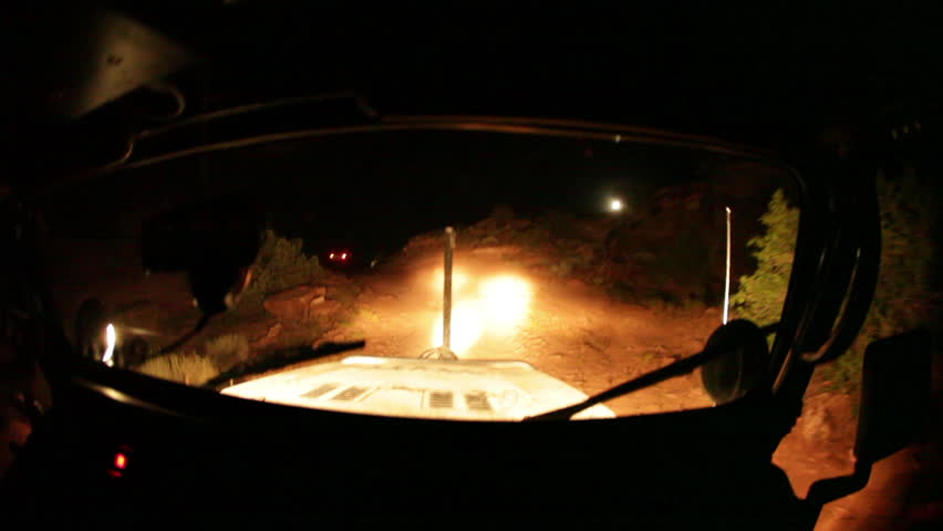 Jeep Driving a Trail at Night