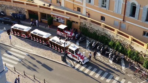 Monaco-Ville, Monaco - October 4, 2016: Red and White Trackless Train for Sightseeing in Monaco on the Street of Monaco-Ville, French Riviera
