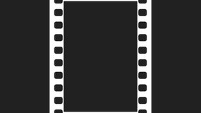 35mm Film Strip Moveing on black background. Seamless Loopable Video Footage on solid black screen. Abstract Film Strip design template. Film Strip Seamless Pattern with chroma key.