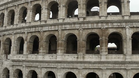 Roman Colosseum, tourists walking inside beautiful antique amphitheater