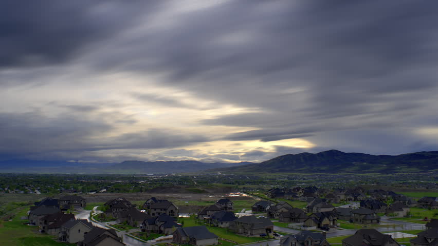 Time-lapse of heavily clouded sunset over Utah valley.
