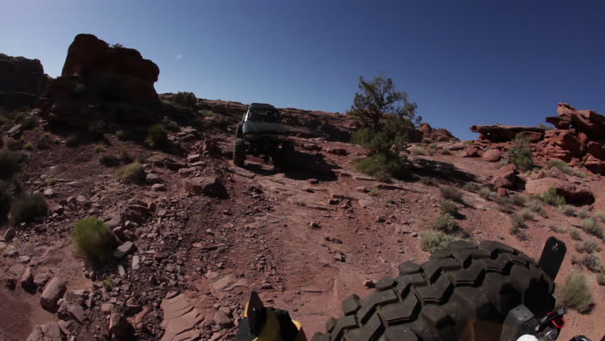 Truck Following a Jeep on a Rocky Trail