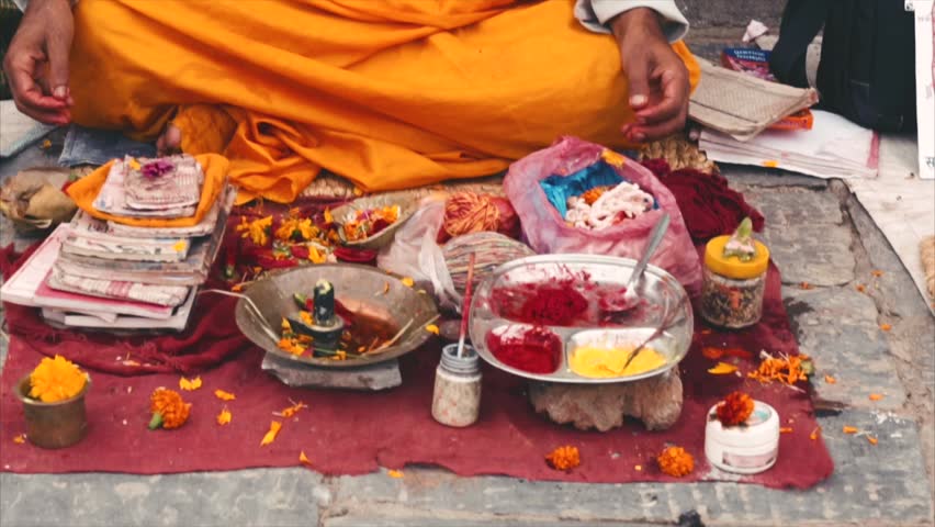 Nepali Brahmin priest sitting near the temple of Pashupatinath in Kathmandu. Nepal. Closeup
