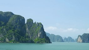 Sailing past some of the many tropical islands of Halong Bay Vietnam.