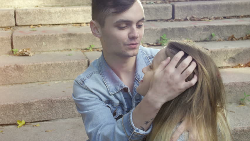 Cute couple on a date in the park on a sunny day