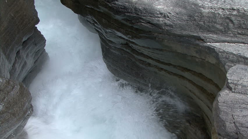 See the power of the water as it thunders through Mistaya Canyon in Alberta,