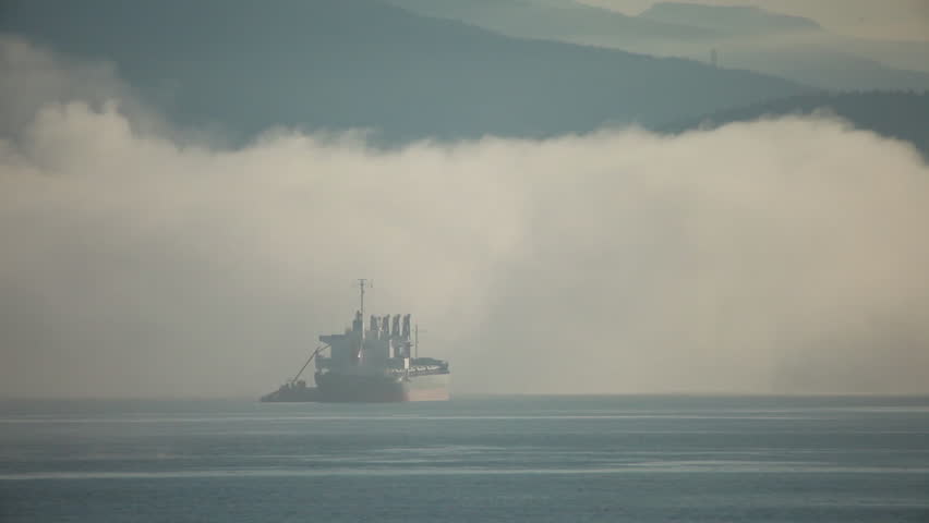 Boat entering a cloud of steam