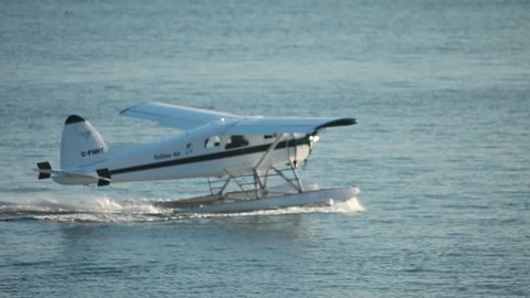 VANCOUVER, BC, CANADA - CIRCA 2011; Floatplane sliding on water