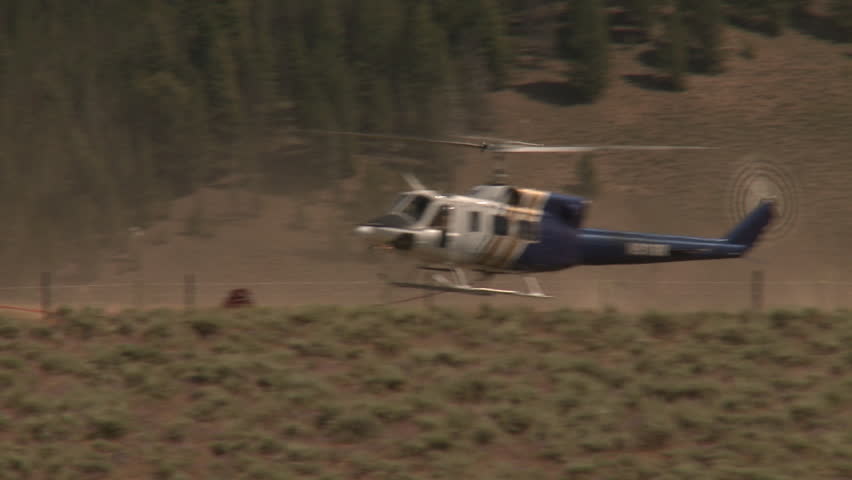 YELLOWSTONE NATIONAL PARK, WYOMING, USA - CIRCA 2011; Landing Helicopter Spews