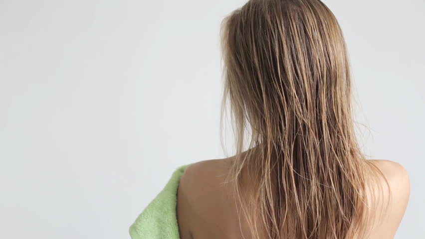 Women wipes her hair