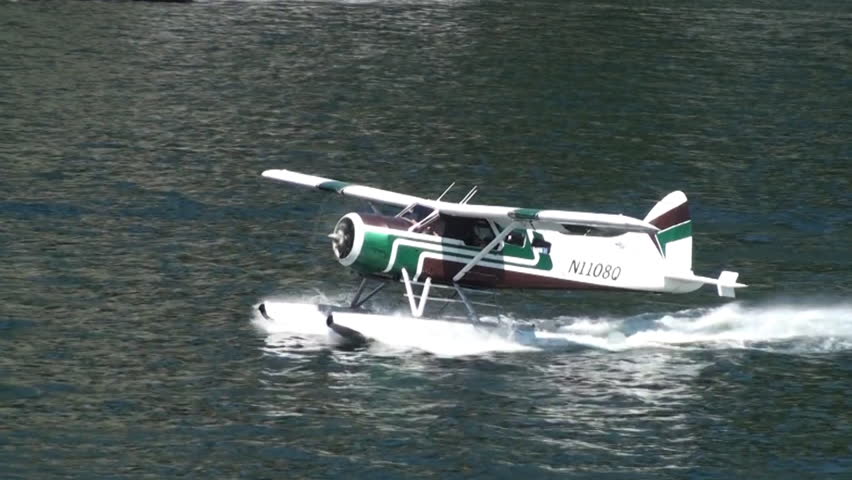 VANCOUVER, BC, CANADA - CIRCA 2011; Green float-plane taxiing