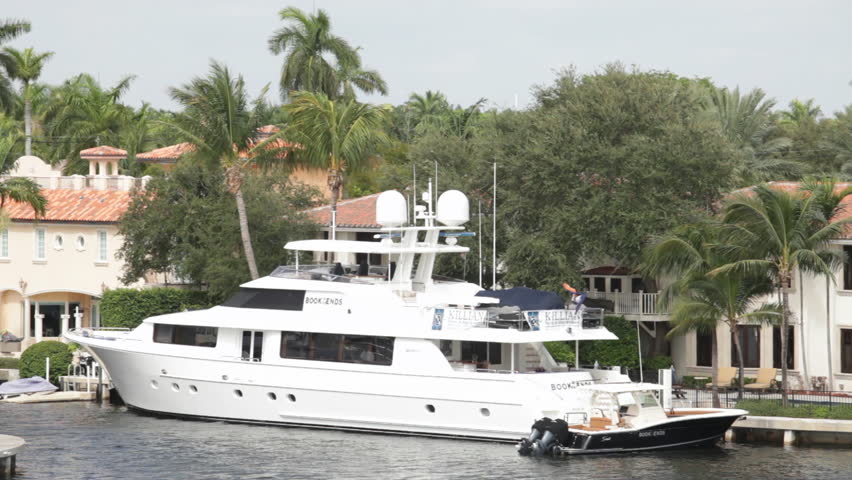 FLORIDA, USA - CIRCA 2011; Yacht Anchored Near Beach Houses