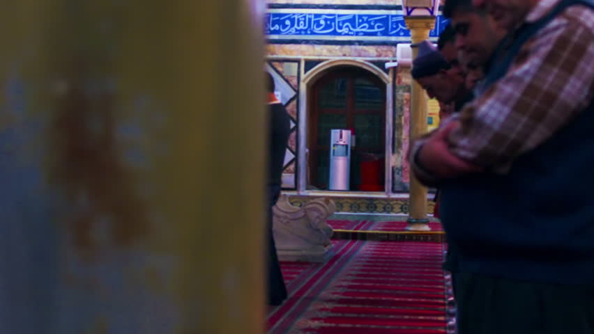 Praying muslims at a mosque filmed in Israel.