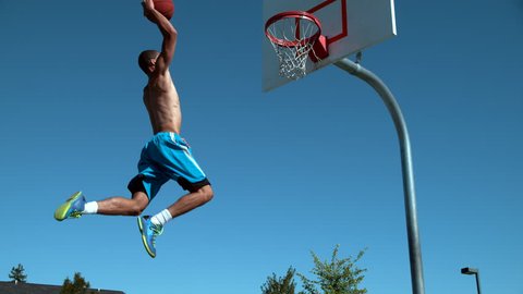 Super slow motion shot of basketball basketball slam dunk, shot on Phantom Flex 4K
