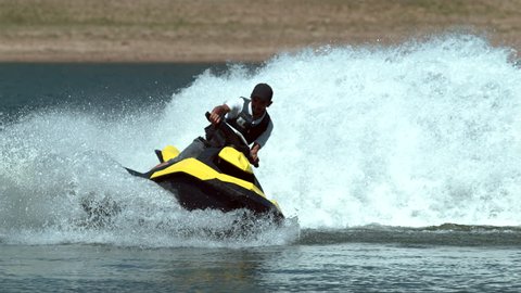 Man riding personal water craft on lake, super slow motion, shot on Phantom Flex 4K