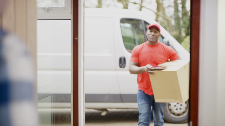 4K Friendly delivery driver bringing package to customer's door & getting electronic signature. Shot on RED Epic. | Shutterstock HD Video #20208295