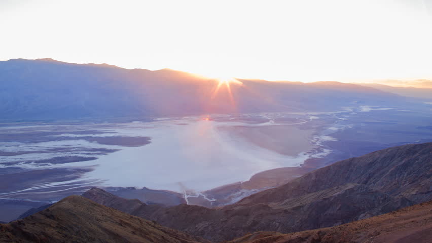 Time lapse with tilt up motion of sunset afterglow at Badwater Basin, shot from Dante