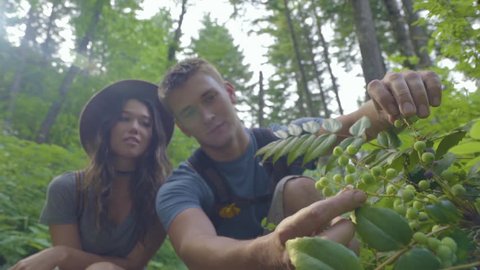 Man Collects Berries In Forest, Shares Them With His Girlfriend (Slow Motion)