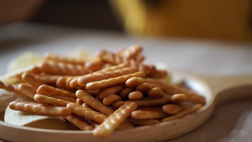  girls hands taking biscuit and eat