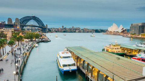 Sydney, Australia - June 26, 2016: 4k hyperlapse video of ferries and people visiting Circular Quay in Sydney CBD, with view of Harbour Bridge and Opera House