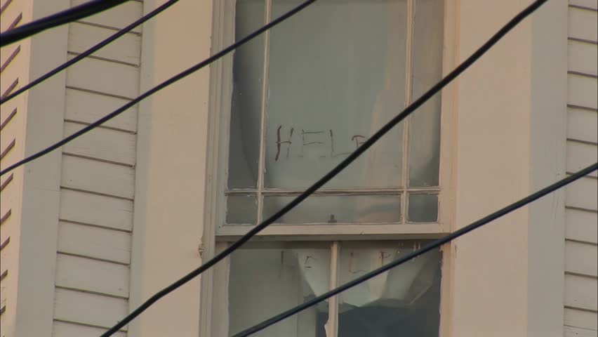 Home with DOA and Help Markings from Hurricane Katrina, Camera Zooms out to Wide Shot.
