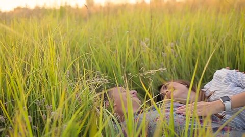 couple lying in the grass.