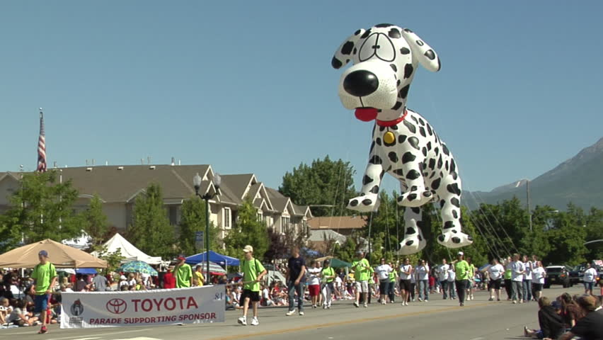 UTAH - CIRCA 2011: Unidentified people with an dog balloon float in a parade