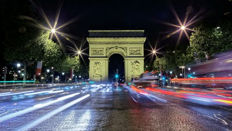 Arch of Arc de Triomphe at night, Paris, France, Traffic time lapse, Etoile, one of the monuments of Paris, including Eiffel, Louvre, Montmartre, Montparnasse, Seine, Trocadero, Pompidou, Notre Dame