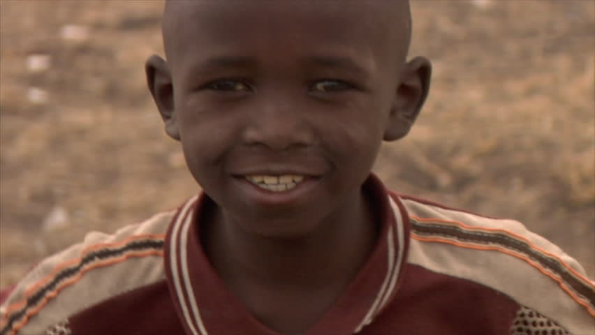 Kenya - Circa 2006: Close up of unidentified little boys face as he does hand