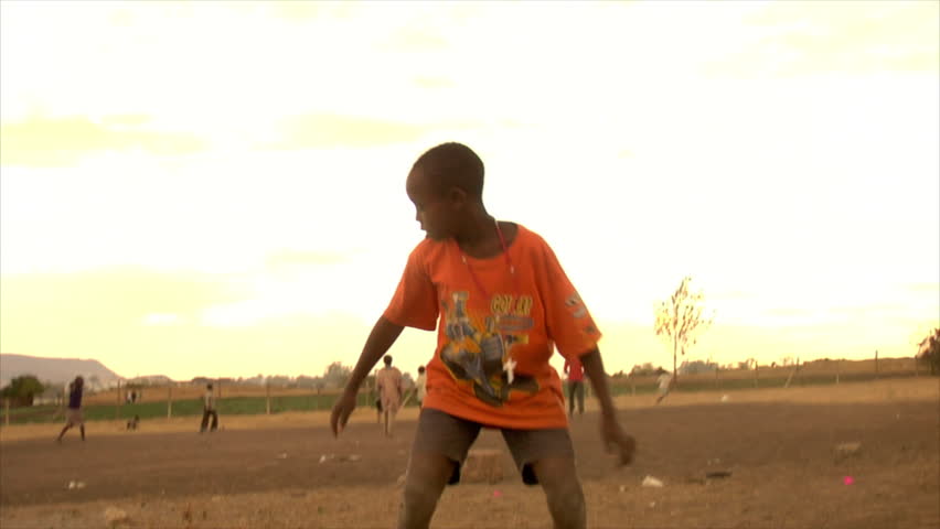 KENYA - CIRCA 2006: Slow motion of an unidentified little boy does a backflip