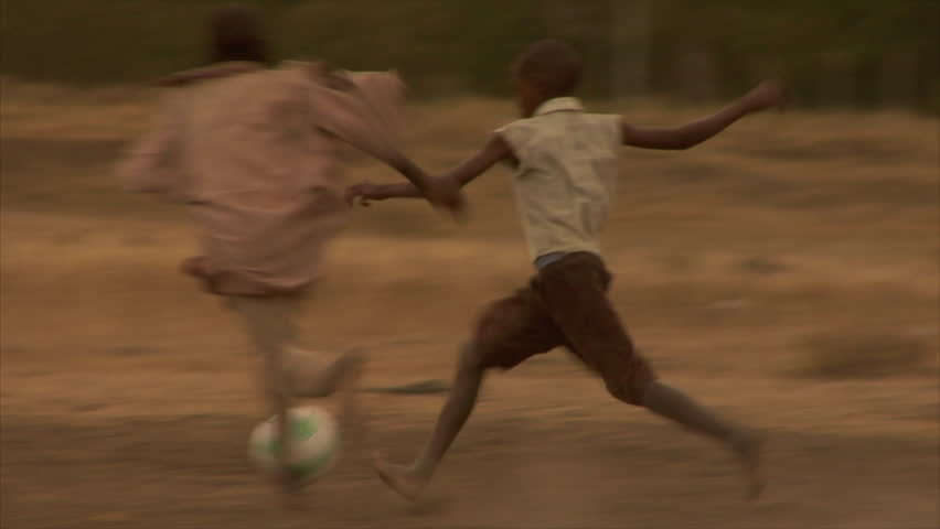 Kenya - Circa 2006: Unidentified children play soccer circa 2006 in Kenya.