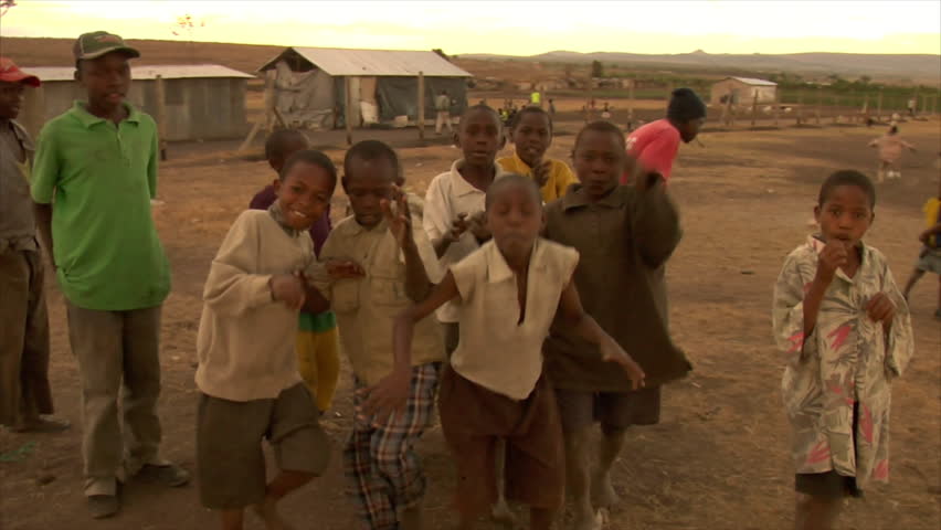 KENYA - CIRCA 2006: Unidentified kids make faces and smile at the camera in